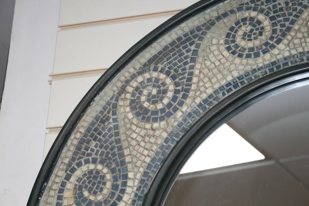 A circular mosaic framed wall mirror, overall diameter 94cm